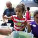 Gabriella Porter, 2, and Maya Miller, 7, create sand dart necklaces at the James Lee Family and Cosmetic Dentistry tent during the 18th annual African American Downtown Festival on Saturday, June 1. Daniel Brenner I AnnArbor.com